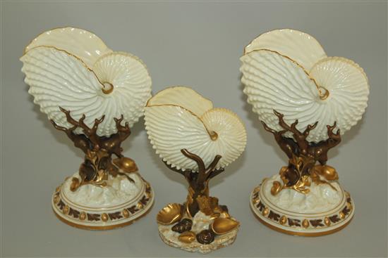 Three Royal Worcester nautilus shell vases, late 19th century, 22cm and 17.5cm